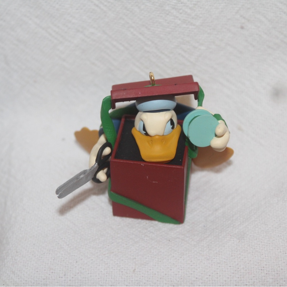 Vintage Disney Donald Duck wrapping a present Christmas Hallmark Ornament